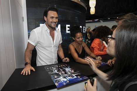 The cast and executive producers of EMERGENCE signed autographs at the ABC Booth, where exclusive merchandise is being made available. - Owain Yeoman, Zabryna Guevara